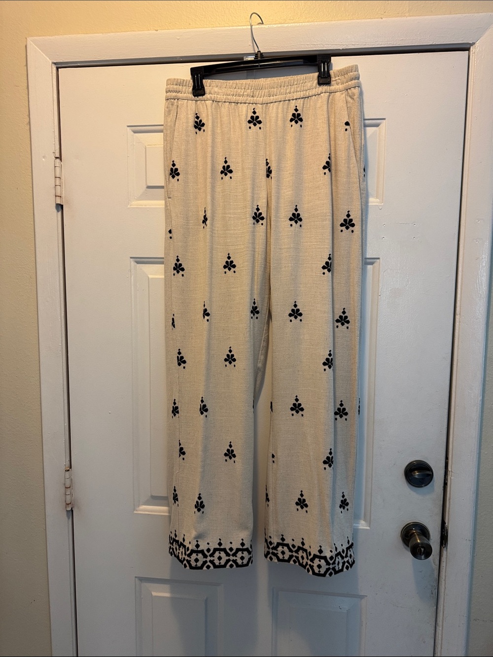 Ladies embroidered muslin cream and black slacks
